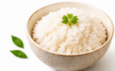 Bowl of white rice with green garnish
